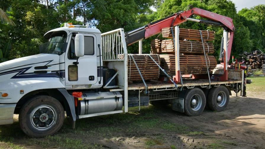Whitsunday truck moving logs