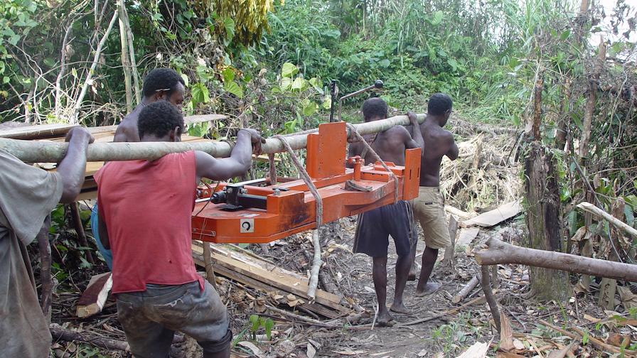 LT15 portable sawmill transported through the jungle